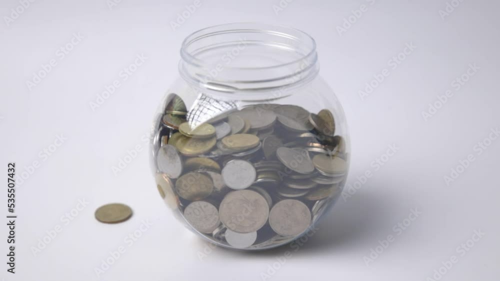 Man hand putting Malaysia currency coin on white background Man hand putting Malaysia currency coin on white background