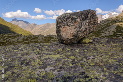 Rock placed in a valley in the Italian Alps.