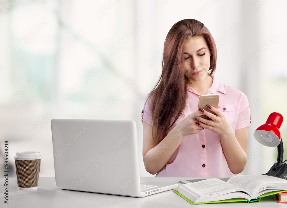 Positive woman work with smartphone or studying Positive woman work with smartphone or studying