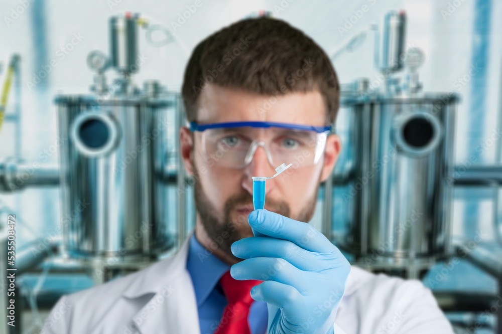 Young scientist work and examine tests in laboratory. Young scientist work and examine tests in laboratory.