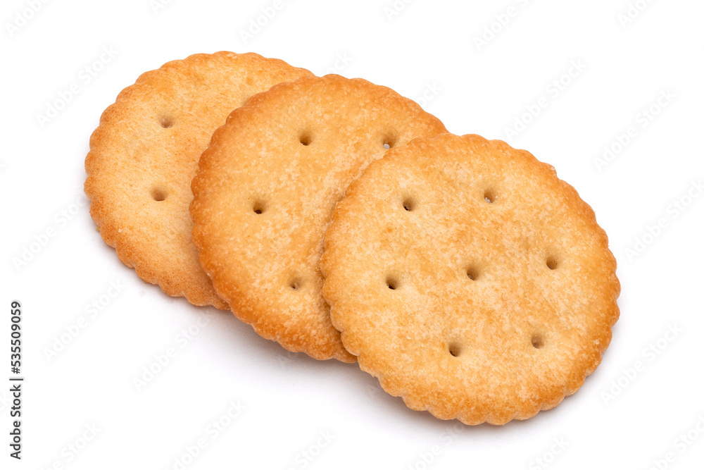 Healthy whole wheat cracker on white background. Stack of Saltine crackers isolated on white background. Round crackers.