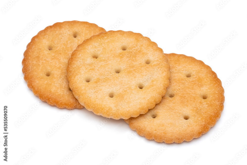 Healthy whole wheat cracker on white background. Stack of Saltine crackers isolated on white background. Round crackers. Healthy whole wheat cracker on white background. Stack of Saltine crackers isolated on white background. Round crackers.