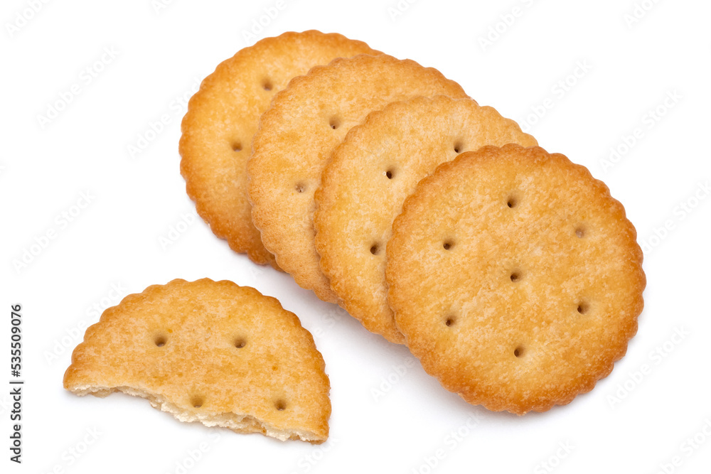 Healthy whole wheat cracker on white background. Stack of Saltine crackers isolated on white background. Round crackers. Healthy whole wheat cracker on white background. Stack of Saltine crackers isolated on white background. Round crackers.
