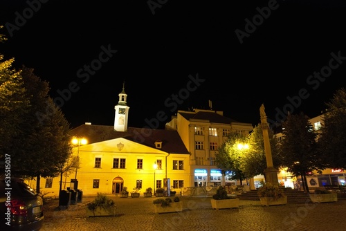 Louny historical city center, Czechia landscape view of historical old city Louny Ceske stredohori Czech republic panorama church and old houses and fortifications and main town square,Jan Hus statue	 photo