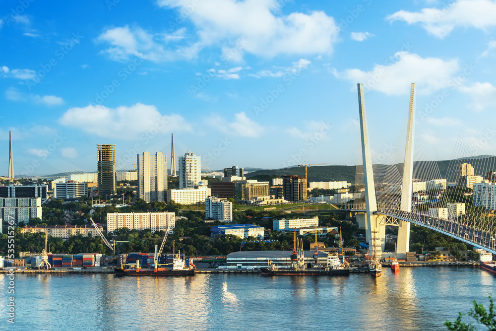 Vladivostok, Russia. Urban landscape of the modern city at sunset from a height.