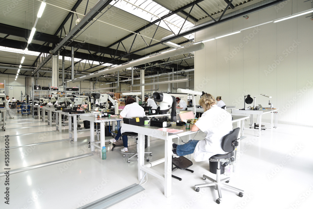 © industrieblick - workers in a factory for the production of electronics - modern industrial enterprise