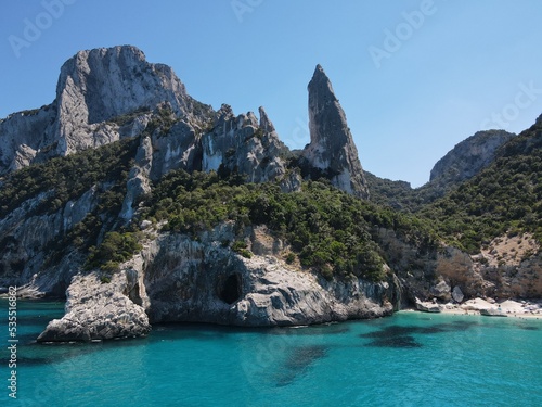 Aerial view of the famous Cala Goloritze in Orosei Gulf, East Sardinia, Italy. Drone and birds eye of clear and crystalline water over the top of Punta Salinas, Sardinia (Sardegna). 