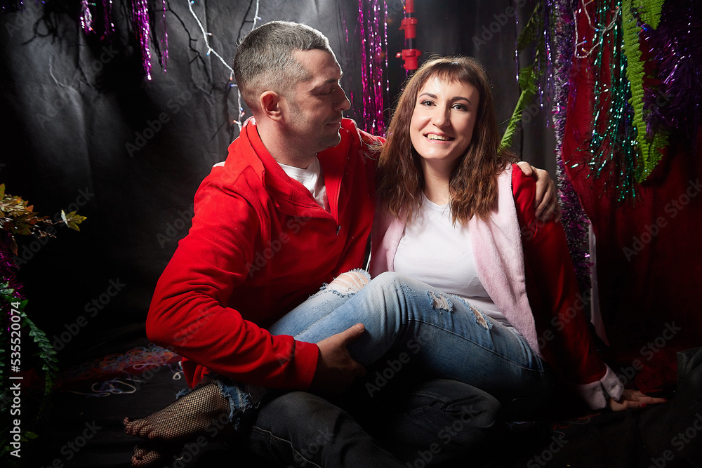 Funny huppy couple in the room decorated for Christmas Funny huppy couple in the room decorated for Christmas