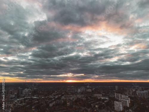 Aerial evening dramatic sunset Kharkiv city Pavlove Pole district. Multistory residential buildings in autumn