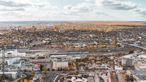City aerial view above Central Kharkiv railway station depot, Pivdennyy Vokzal in autumn, downtown city streets rooftop in Kharkiv, Ukraine
