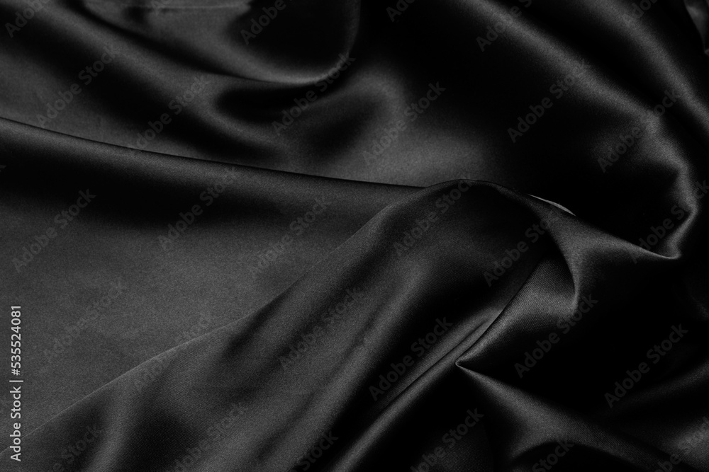 Part of the dark fabric texture of the fabric for the background and decoration of the work of art, a beautiful crumpled pattern of silk or linen. A crumpled piece of cloth Part of the dark fabric texture of the fabric for the background and decoration of the work of art, a beautiful crumpled pattern of silk or linen. A crumpled piece of cloth