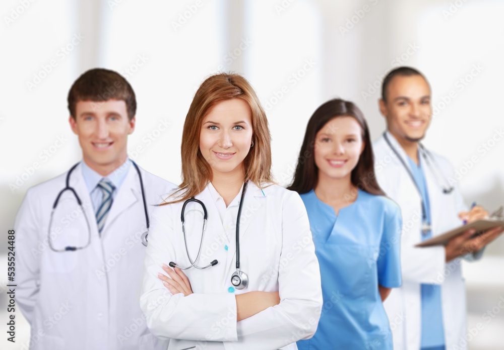 Medical team of doctors on hospital background Medical team of doctors on hospital background