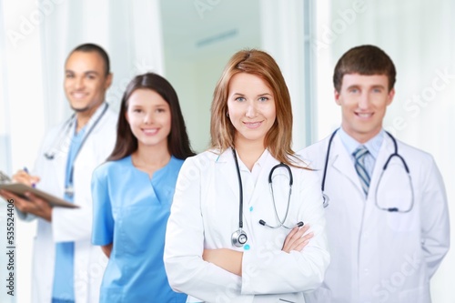 Medical team of doctors on hospital background