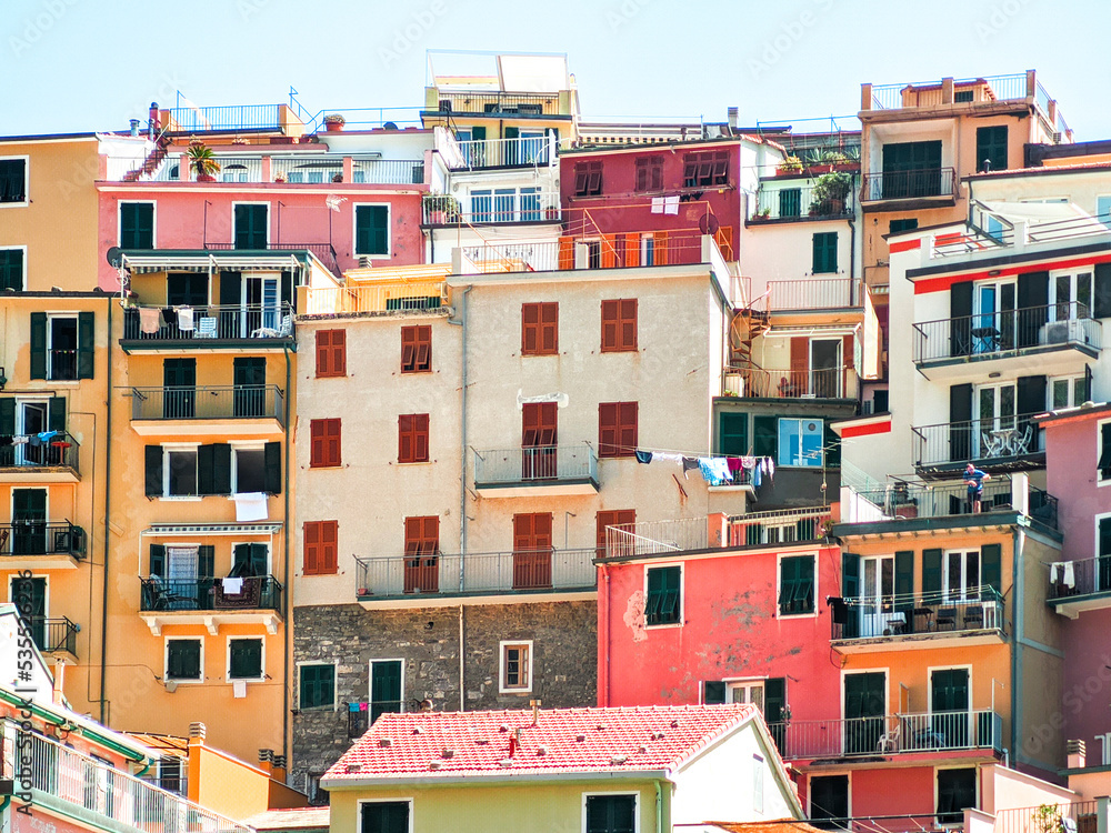 ancient multicolored Ligurian buildings of the village of manarola, architectural background