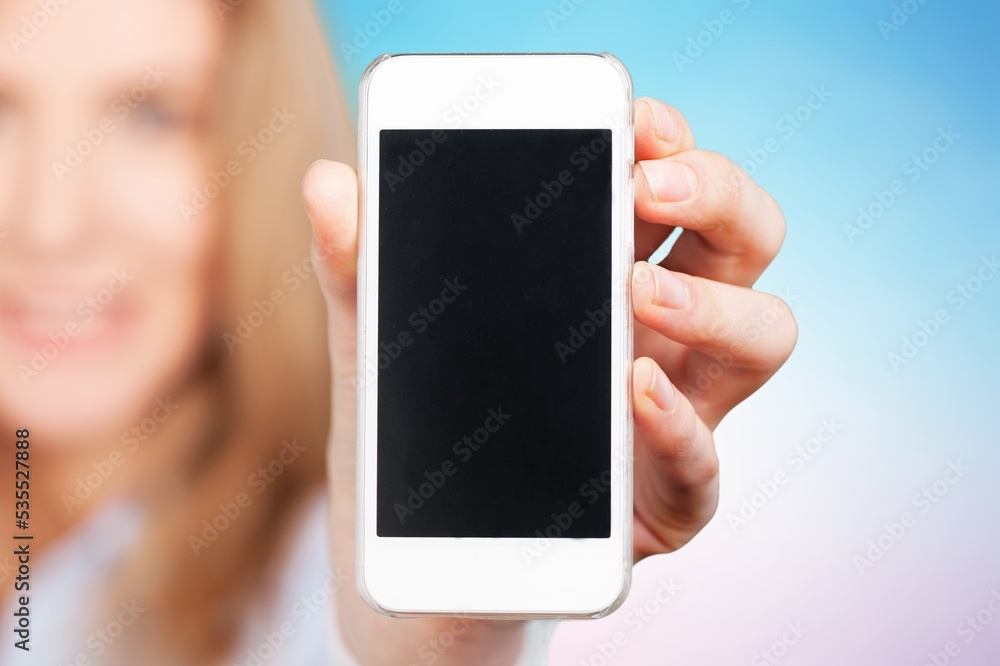 Confident woman posing with modern phone