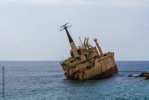 Old shipwreck and blue water