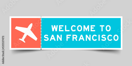 Orange and blue color ticket with plane icon and word welcome to san francisco on gray background