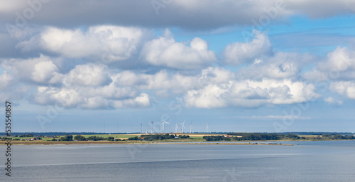 Wind turbin in the field Sønder Arup and near Feggesund,Denmark,Europe	 photo