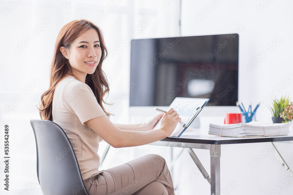 freelance Accounting Asian businesswomen doing calculating income-expenditure and analyzing real estate investment data, Financial and tax systems concept.