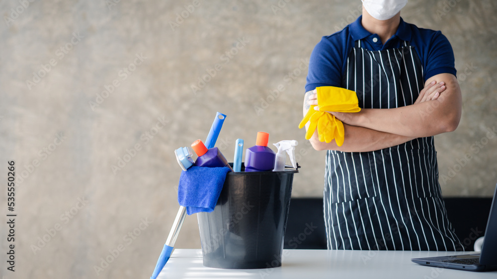 The person cleaning the room, the cleaning staff of the cleaning company. Cleaning staff. Concept of cleanliness in the organization. The person cleaning the room, the cleaning staff of the cleaning company. Cleaning staff. Concept of cleanliness in the organization.