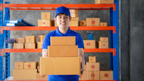 The man is in the warehouse waiting to be sold and delivered to the customers, the warehouse for the storage of private companies, the stock counting and the import and export of orders and sales.
