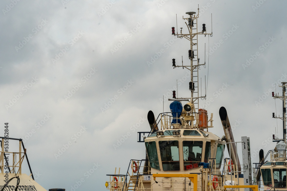 Tugboat on the pier in Southampton, Hampshire, United Kingdom on a cloudy day Tugboat on the pier in Southampton, Hampshire, United Kingdom on a cloudy day