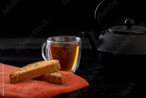 cup of tea and teapot and biscotti