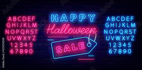 Happy Halloween sale neon label on brick wall. Shiny blue and pink alphabet. Vector stock illustration