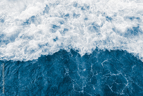Dark blue sea ocean wave and liquid white foam