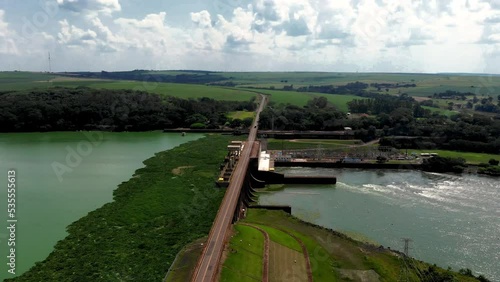 Aerial view of Dam at reservoir with flowing water, hydroelectricity power station.