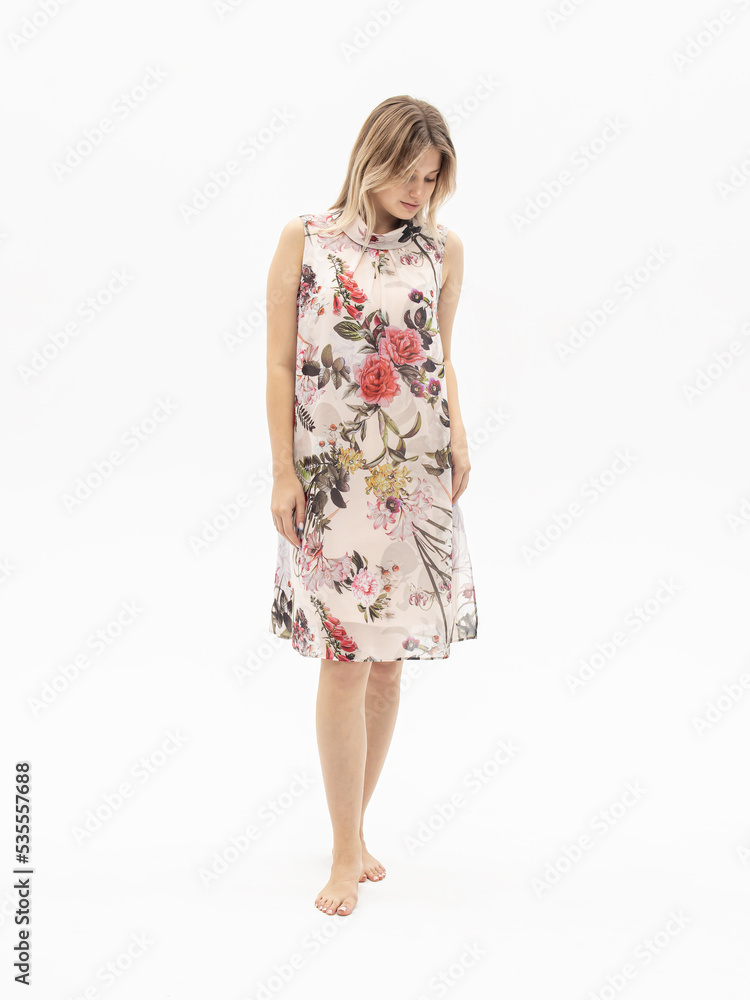 Woman in sleeveless chiffon dress on white background. Summer dress for school, office Woman in sleeveless chiffon dress on white background. Summer dress for school, office
