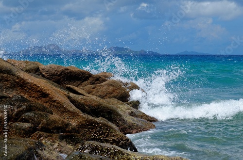 Scenic splashes of surf at Anse Severe beach on La Digue island, Seychelles photo