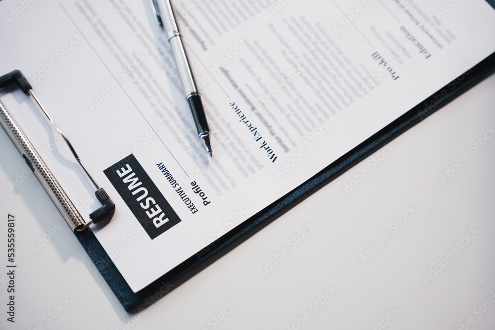 Businesswoman Holding Resume,Examiner reading a resume during job interview at office Business and human resources concept. Businesswoman Holding Resume,Examiner reading a resume during job interview at office Business and human resources concept.