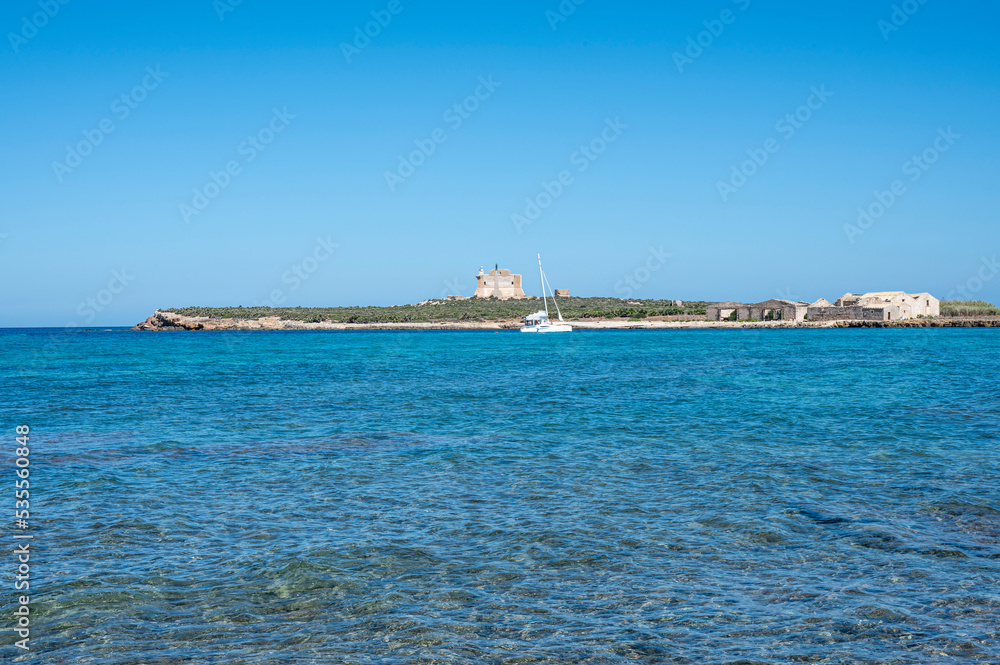 The island of Capo Passero in front of Portopalo where the waters of the two seas divide, the Ionian Sea and the Mediterranean Sea