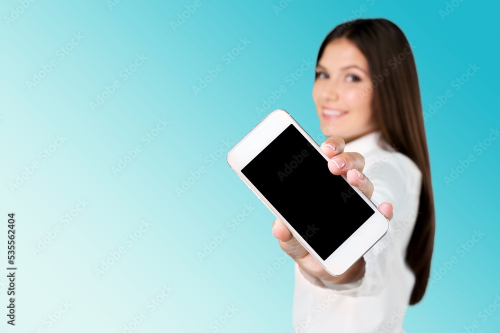 Beautiful woman holding blank screen smartphone Beautiful woman holding blank screen smartphone