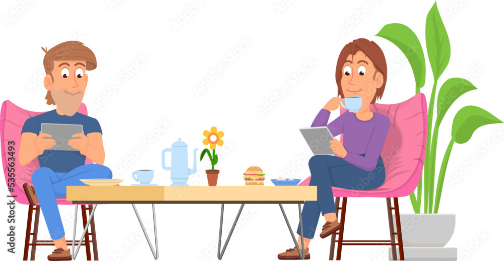 Couple sit at coffee table with gadgets. Modern lifestyle Couple sit at coffee table with gadgets. Modern lifestyle