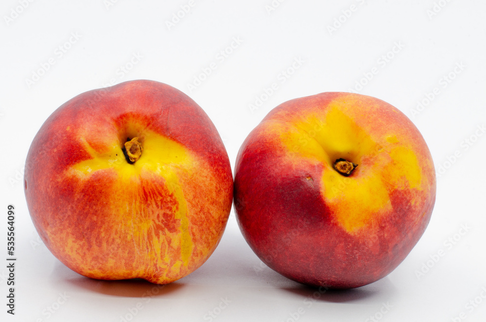 Red colored nectarines. Red nectarine fruit isolated on white background.
Red colored nectarines. Red nectarine fruit isolated on white background.