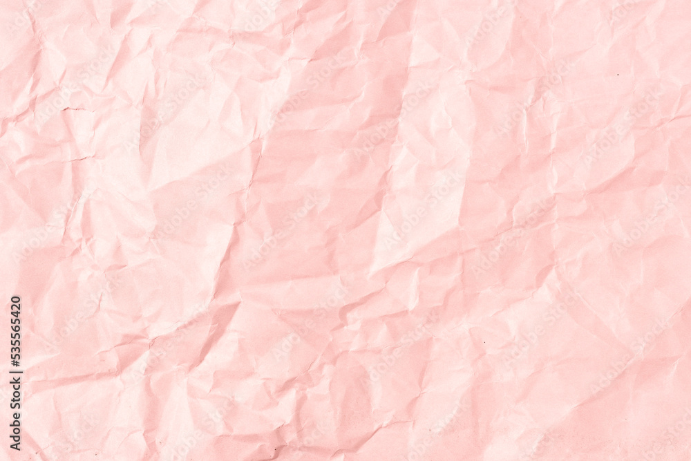 Pink crumpled paper background texture. Full frame