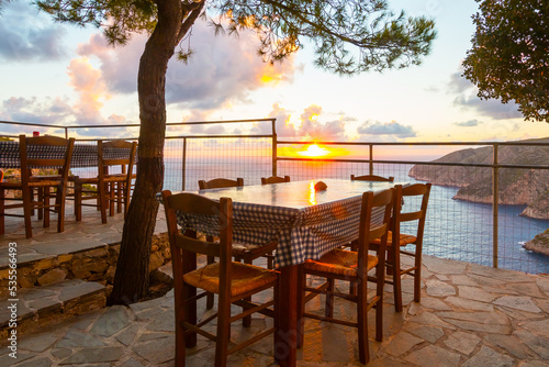 Romantic terrace during sunset at a restaurant on Zakynthos (Ionic Islands, Kampi, Greece)