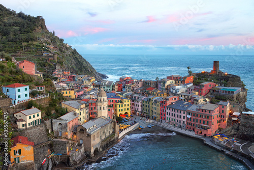 Fototapeta Naklejka Na Ścianę i Meble -  Fantastic panorama of Vernazza, amazing colorful medieval buildings and fishing boats in harbor at sunset, Cinque Terre National Park, Liguria, Italy, Europe