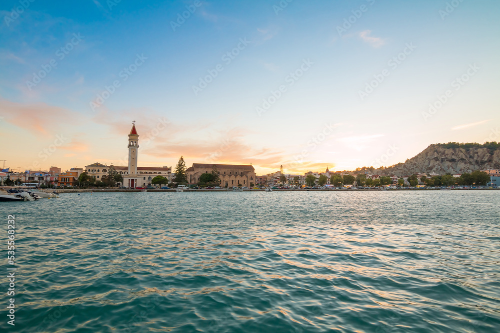 View on town hall and Saint Dionysios Church, Ionian Sea, Zakynthos island, Greece, Europe. Amazing sunset view. Zakynthos tower in the evening lights. The main harbor of the city. 