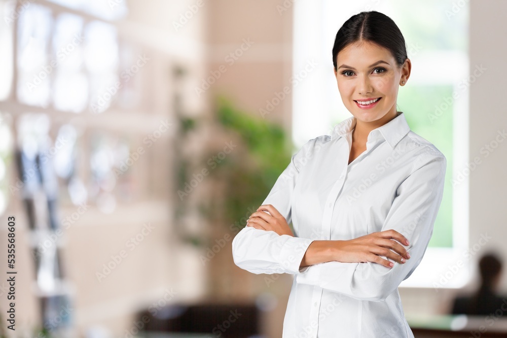 Happy saleswoman welcoming client standing in office. Happy saleswoman welcoming client standing in office.