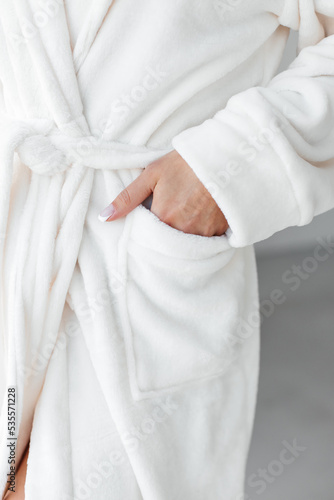 Stress relief. Rest after hard working day. Young woman in spa bathrobe taking shower bath. Beauty treatment, body and skin care concept