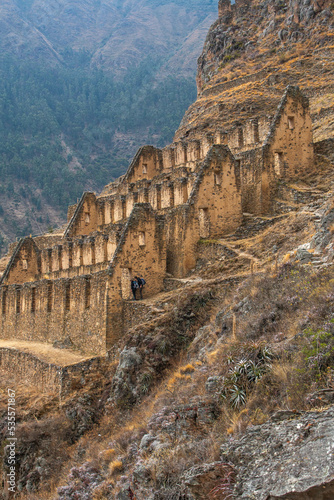 Pinkuylluna archaeological site with views of the trail and people walking in Ollantaytambo, Sacred Valley Peru. photo