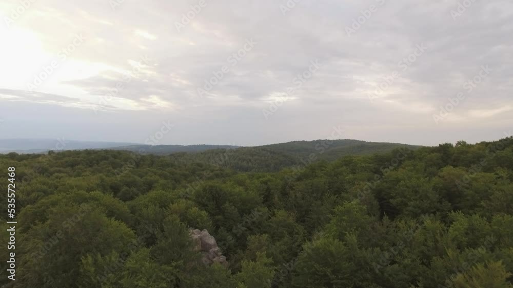 Drone flies over epic limestone rocks. Bright landscape with big rocky boulders. Drone flies over epic limestone rocks. Bright landscape with big rocky boulders.