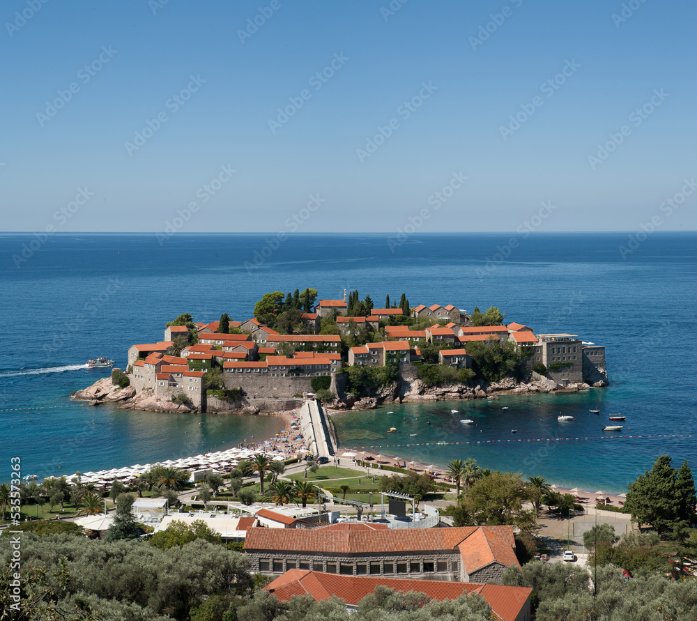 Aman Sveti Stefan with a promenade and beaches, Montenegro. Top view from the Jadran road. St. Stephen islet for a poster, calendar, post, screensaver, wallpaper, postcard, banner, cover, website