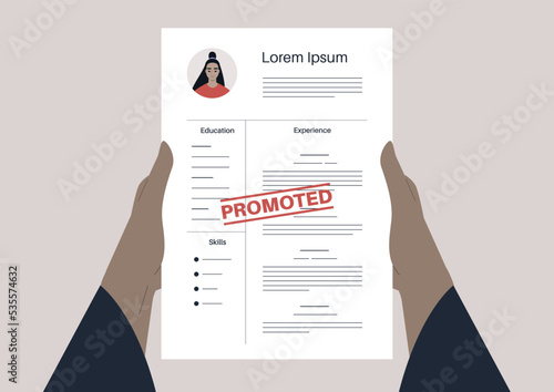 Work promotion, hands holding a CV with a PROMOTED red rubber stamp printed on