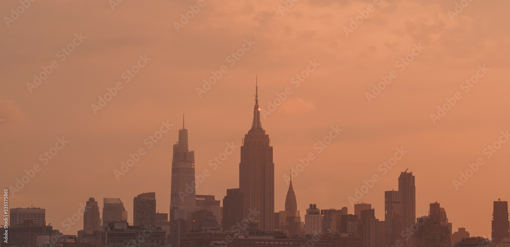 city skyline sunset sky New York Manhattan urban river color orange 