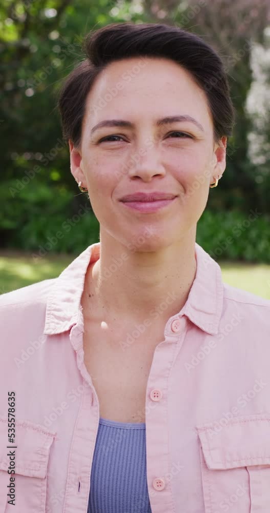 Vertical video of portrait of happy caucasian woman