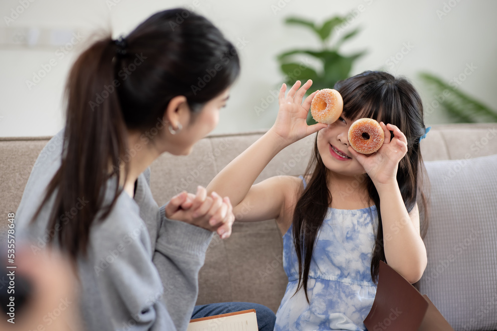 Happy mother and child having fun in living room at home, happy family holiday concept. Happy mother and child having fun in living room at home, happy family holiday concept.